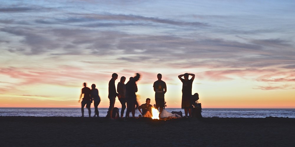 Rv_Rental and friends by a campfire.